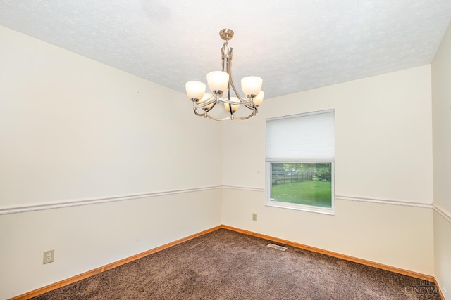 6409 Stapleton Ct, Fairfield Twp, OH 45011 - spare room with carpet flooring, a chandelier, and a textured ceiling