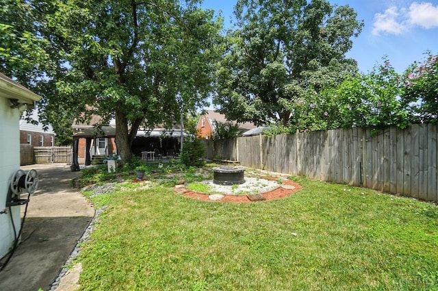 3760 Feldkamp Ave, Green Twp, OH 45211 - fenced backyard with a fire pit