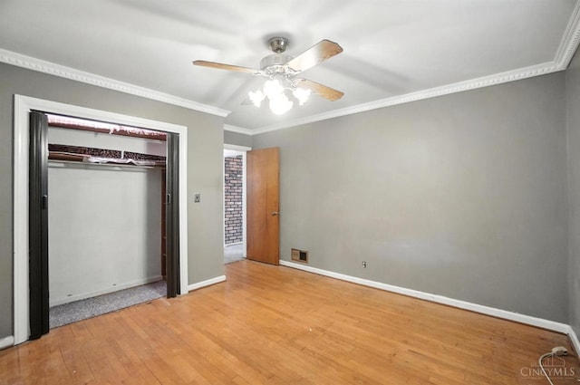 3760 Feldkamp Ave, Green Twp, OH 45211 - unfurnished bedroom featuring crown molding, wood finished floors, a closet, and a ceiling fan