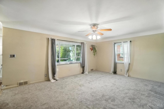 3760 Feldkamp Ave, Green Twp, OH 45211 - unfurnished room with plenty of natural light, ceiling fan, and carpet