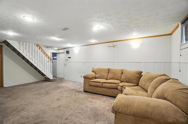 3760 Feldkamp Ave, Green Twp, OH 45211 - living area with a textured ceiling, stairway, a wainscoted wall, ornamental molding, and carpet floors