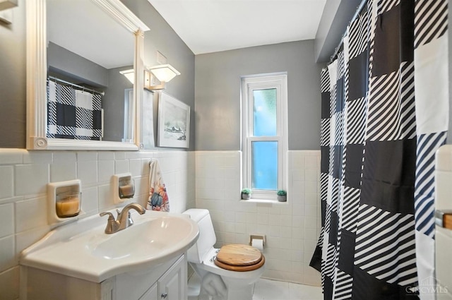 3760 Feldkamp Ave, Green Twp, OH 45211 - bathroom featuring tile walls, vanity, a wainscoted wall, a shower with curtain, and tile patterned floors