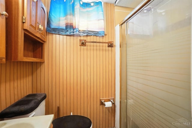 3760 Feldkamp Ave, Green Twp, OH 45211 - bathroom with a stall shower, vanity, and wood walls
