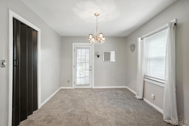 3760 Feldkamp Ave, Green Twp, OH 45211 - carpeted empty room featuring a chandelier and baseboards