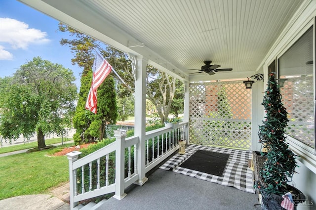 3760 Feldkamp Ave, Green Twp, OH 45211 - covered porch with a ceiling fan and a lawn