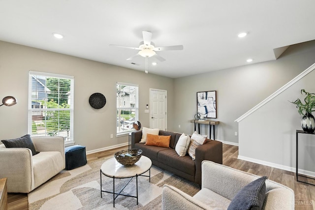 1545 Ruth Ave, Cincinnati, OH 45207 - living room with ceiling fan, wood finished floors, and recessed lighting