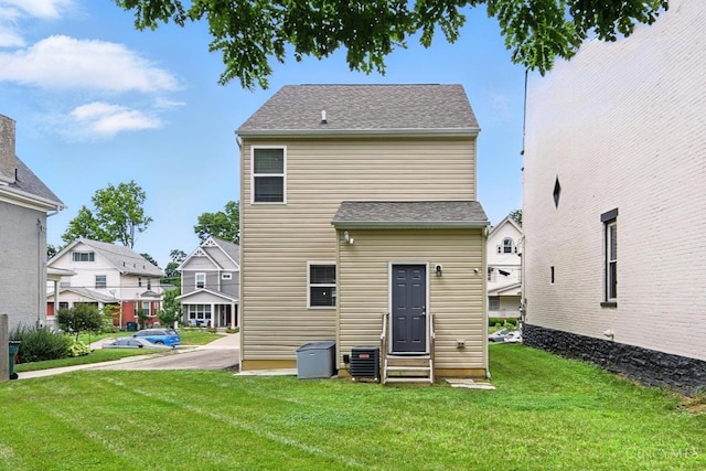 1545 Ruth Ave, Cincinnati, OH 45207 - back of house with entry steps, a yard, and a residential view