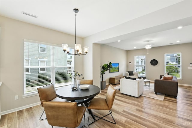 1545 Ruth Ave, Cincinnati, OH 45207 - dining room with light wood-type flooring, a chandelier, recessed lighting, and a ceiling fan