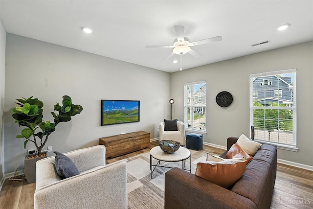 1545 Ruth Ave, Cincinnati, OH 45207 - living area with wood finished floors, a ceiling fan, and recessed lighting
