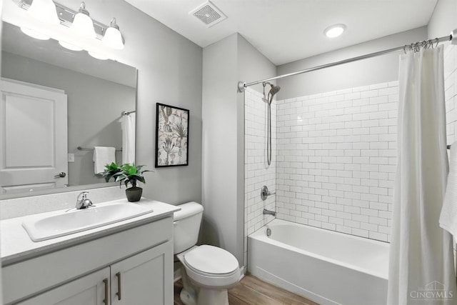 1545 Ruth Ave, Cincinnati, OH 45207 - bathroom with wood finished floors, vanity, and shower / tub combo