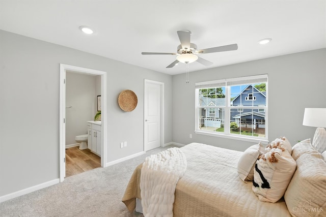 1545 Ruth Ave, Cincinnati, OH 45207 - bedroom with light colored carpet, ensuite bath, a ceiling fan, and recessed lighting