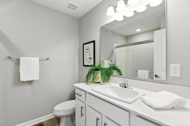 1545 Ruth Ave, Cincinnati, OH 45207 - bathroom featuring an enclosed shower, vanity, and wood finished floors