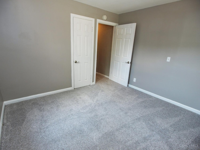 3527 Reemelin Rd, Green Twp, OH 45211 - unfurnished bedroom with baseboards and carpet floors