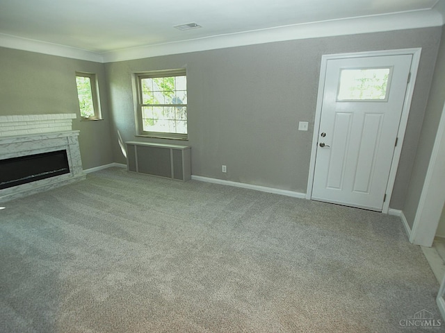 3527 Reemelin Rd, Green Twp, OH 45211 - unfurnished living room featuring radiator heating unit, carpet floors, a premium fireplace, and ornamental molding