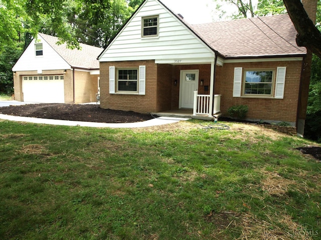 3527 Reemelin Rd, Green Twp, OH 45211 - view of front of house featuring brick siding, a garage, and a front lawn
