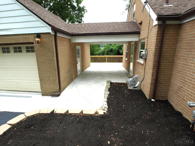 3527 Reemelin Rd, Green Twp, OH 45211 - view of home's exterior with brick siding, a shingled roof, and an attached garage