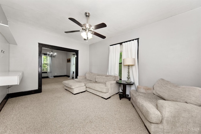 122 Fairview Ave, Washington Twp, OH 45171 - carpeted living room with a chandelier and a ceiling fan