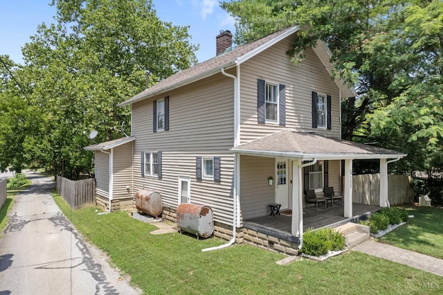 122 Fairview Ave, Washington Twp, OH 45171 - view of property exterior with oil tank, a chimney, a porch, and roof with shingles