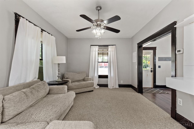 122 Fairview Ave, Washington Twp, OH 45171 - living room featuring healthy amount of natural light, ceiling fan, dark wood finished floors, and dark carpet