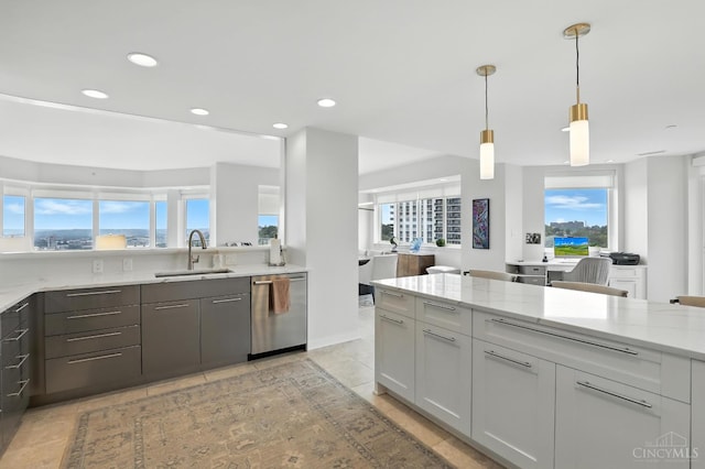 1201 Edgecliff Pl Unit 1083, Cincinnati, OH 45206 - kitchen featuring dishwasher, light stone counters, plenty of natural light, recessed lighting, and pendant lighting