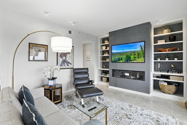 1201 Edgecliff Pl Unit 1083, Cincinnati, OH 45206 - living area with built in features, tile patterned flooring, and a large fireplace