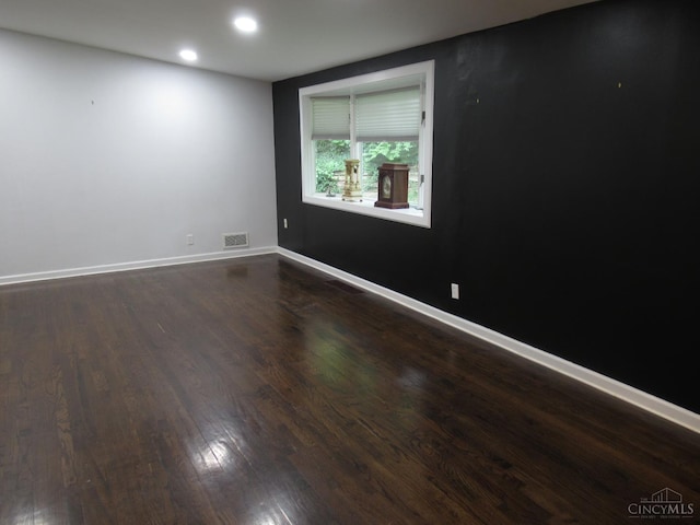 8608 Long Ln, Springfield Twp, OH 45231 - empty room featuring dark wood finished floors and recessed lighting