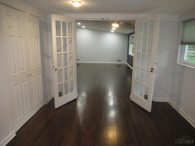 8608 Long Ln, Springfield Twp, OH 45231 - interior space with french doors, wood finished floors, and a textured ceiling