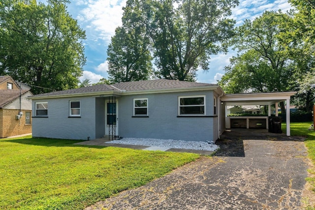 6537 Craigland Ct, Cincinnati, OH 45230 - view of front of property with asphalt driveway, brick siding, a front lawn, and a carport