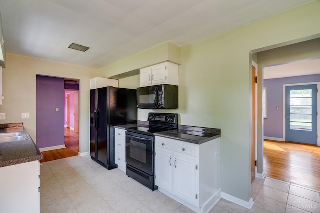6537 Craigland Ct, Cincinnati, OH 45230 - kitchen with black appliances, dark countertops, white cabinetry, and light tile patterned floors
