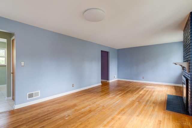 6537 Craigland Ct, Cincinnati, OH 45230 - unfurnished living room with a fireplace and light wood-style floors