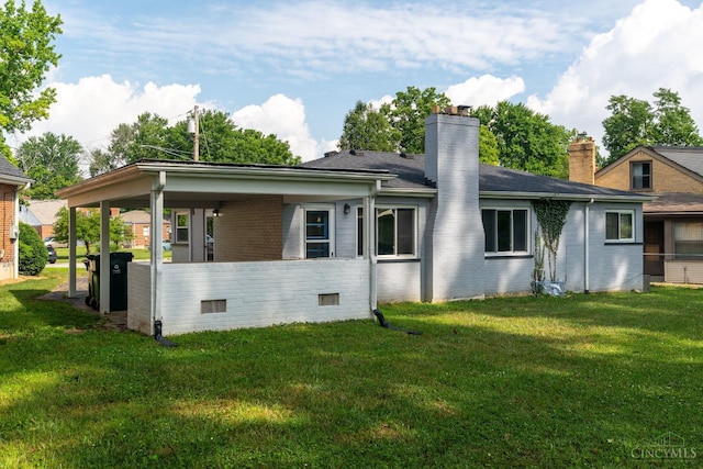 6537 Craigland Ct, Cincinnati, OH 45230 - rear view of property with brick siding, a chimney, and a yard