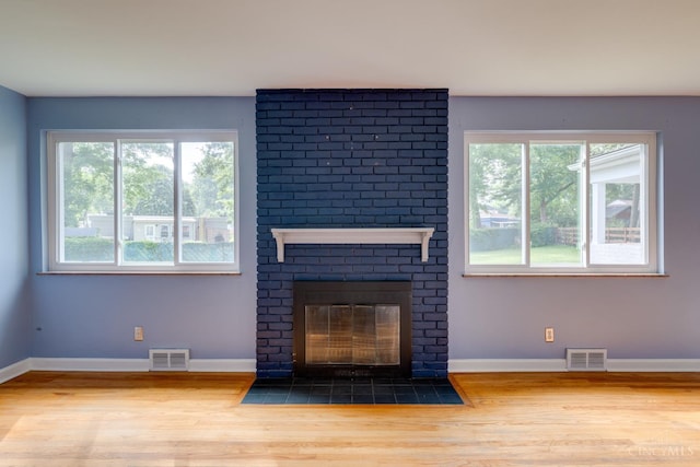 6537 Craigland Ct, Cincinnati, OH 45230 - unfurnished living room with wood finished floors and a brick fireplace