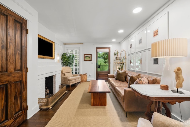 1236 Louden St, Cincinnati, OH 45202 - living room featuring a fireplace, recessed lighting, and dark wood-style flooring