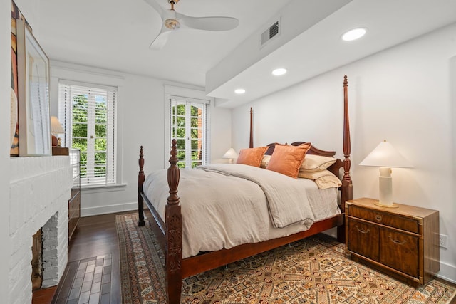 1236 Louden St, Cincinnati, OH 45202 - bedroom with dark wood-type flooring, a brick fireplace, recessed lighting, and ceiling fan