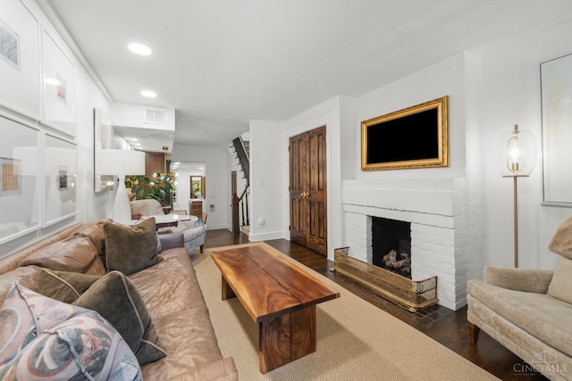 1236 Louden St, Cincinnati, OH 45202 - living area with dark wood-type flooring, recessed lighting, and a fireplace