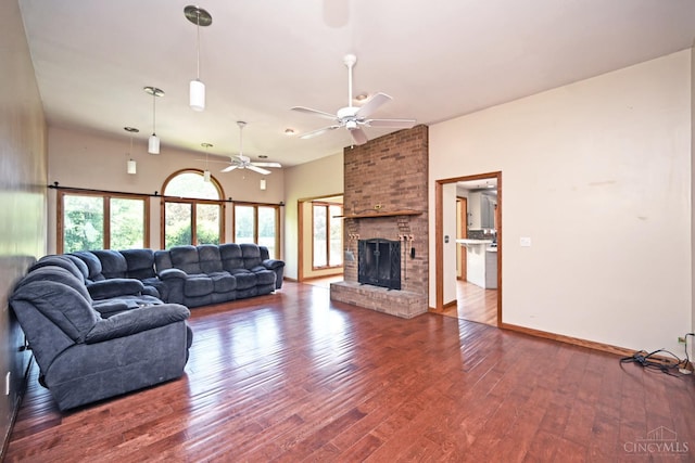 8424 Oak Grove Rd, Georgetown, OH 45121 - living room with wood finished floors, a ceiling fan, and a brick fireplace