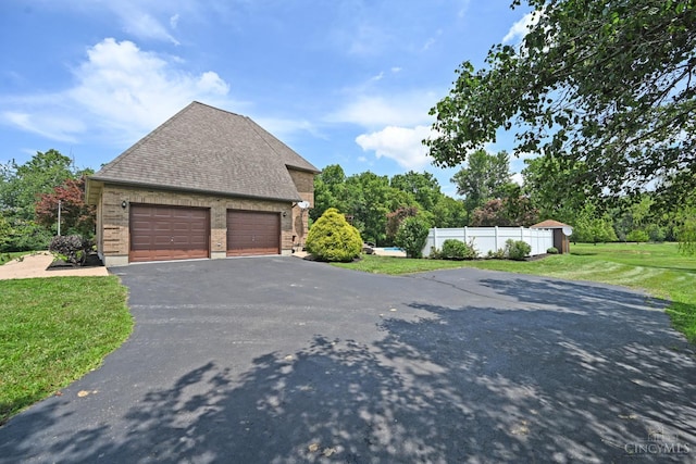 8424 Oak Grove Rd, Georgetown, OH 45121 - view of side of property featuring a shingled roof, brick siding, and driveway