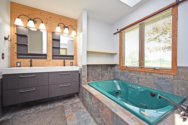 8424 Oak Grove Rd, Georgetown, OH 45121 - full bathroom with stone tile floors, double vanity, a jetted tub, and wood walls