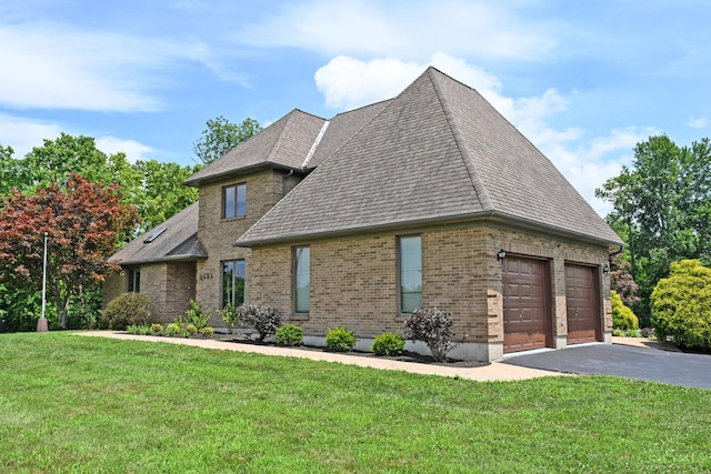 8424 Oak Grove Rd, Georgetown, OH 45121 - view of front of house with brick siding, a front yard, a shingled roof, and asphalt driveway