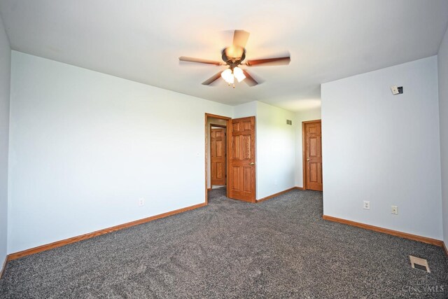 8424 Oak Grove Rd, Georgetown, OH 45121 - unfurnished room with a ceiling fan and dark colored carpet