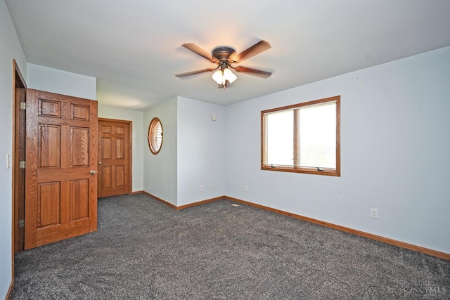 8424 Oak Grove Rd, Georgetown, OH 45121 - spare room with dark colored carpet and a ceiling fan