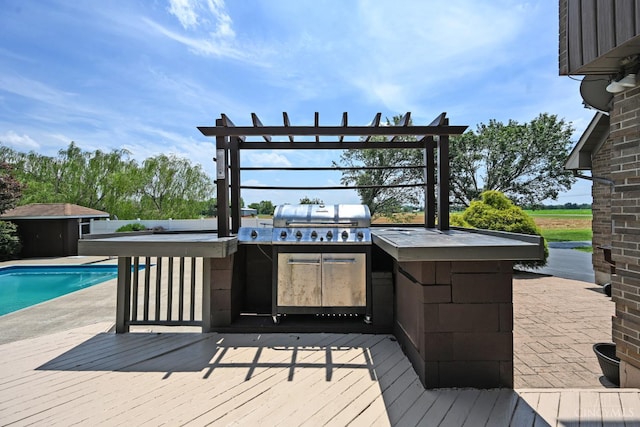 8424 Oak Grove Rd, Georgetown, OH 45121 - wooden deck with an outdoor kitchen, an outdoor pool, and a bar