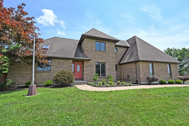 8424 Oak Grove Rd, Georgetown, OH 45121 - view of front facade with brick siding, a front yard, and roof with shingles