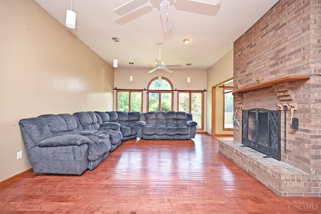 8424 Oak Grove Rd, Georgetown, OH 45121 - living room with a ceiling fan, wood finished floors, and a brick fireplace