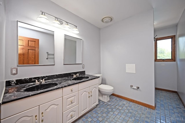 8424 Oak Grove Rd, Georgetown, OH 45121 - bathroom featuring double vanity and toilet
