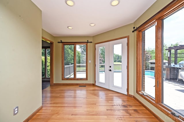 8424 Oak Grove Rd, Georgetown, OH 45121 - entryway featuring french doors, light wood-style flooring, and recessed lighting