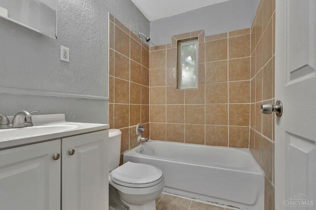 146 Glenridge Pl, Cincinnati, OH 45217 - full bath featuring a textured wall, shower / washtub combination, vanity, and tile patterned flooring