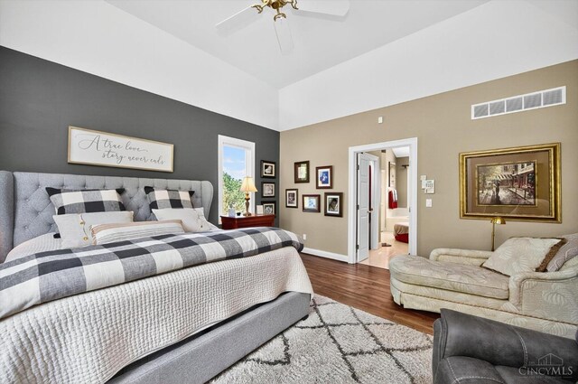 8069 Green Lake Dr, Liberty Twp, OH 45044 - bedroom with wood finished floors, a high ceiling, connected bathroom, and a ceiling fan