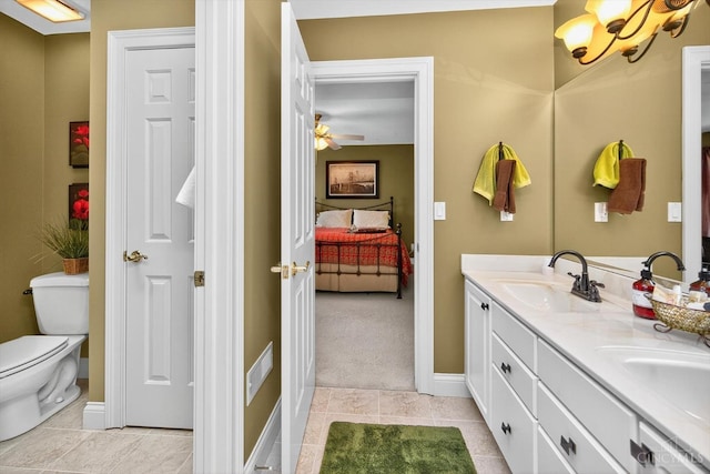 8069 Green Lake Dr, Liberty Twp, OH 45044 - ensuite bathroom with double vanity, tile patterned floors, a chandelier, and a ceiling fan