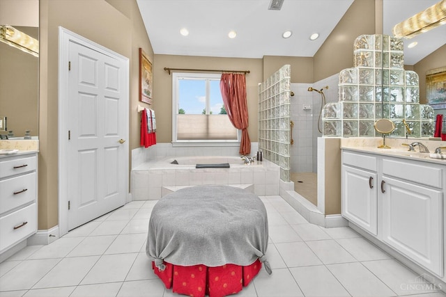 8069 Green Lake Dr, Liberty Twp, OH 45044 - bathroom with vanity, tiled shower, a bath, tile patterned floors, and vaulted ceiling
